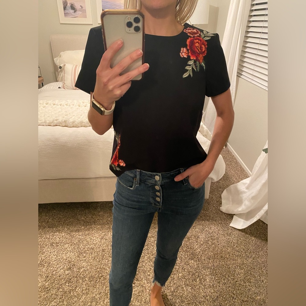 Black shirt with floral embroidery detail